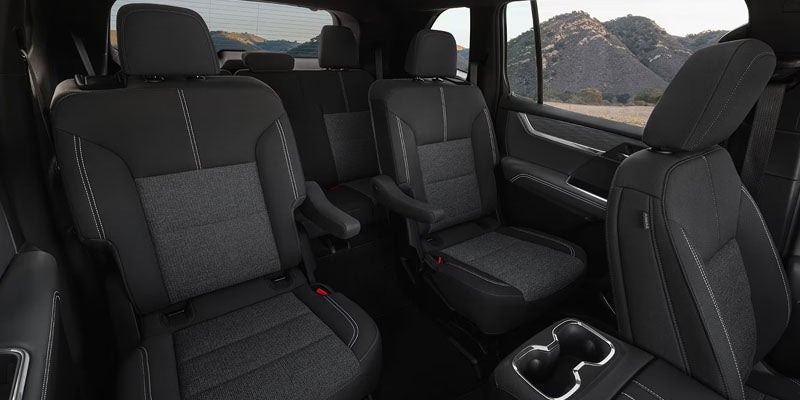 2026 GMC Acadia interior with three row seating and premium cabin design
